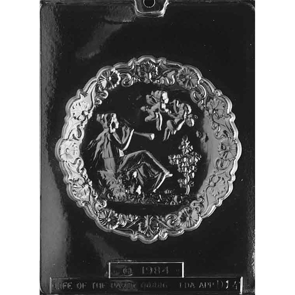 Clear plastic chocolate mold with one large round Mother’s Day plaque design featuring an ornate floral border and a detailed central scene.