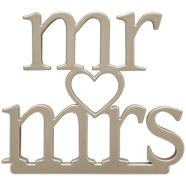 Gold "Mr. & Mrs." cake topper with a heart detail in the center, perfect for weddings and anniversaries.