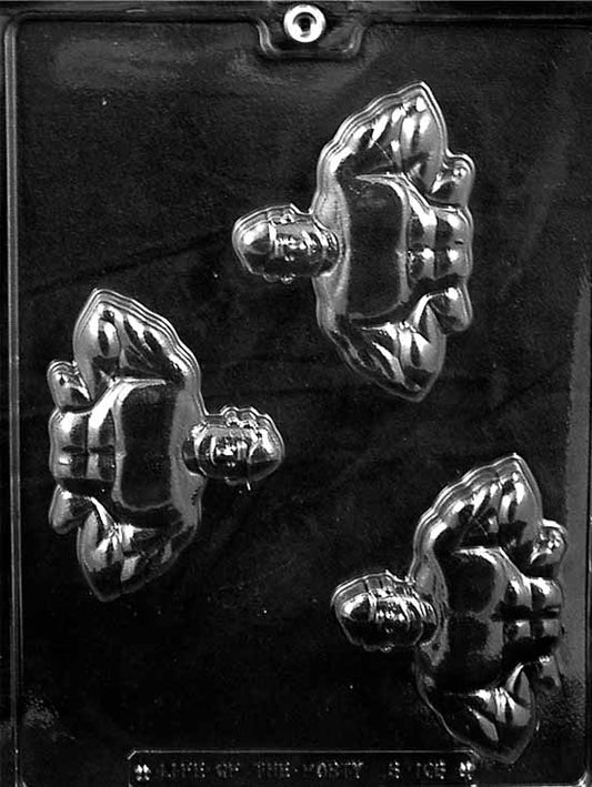 Clear three-cavity chocolate mold showing flexing weightlifter figures with broad shoulders and defined muscles, arranged diagonally on a glossy plastic sheet.