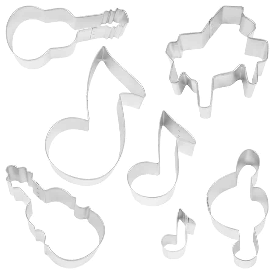 Seven metal cookie cutters in the shape of a piano, treble clef, two musical notes, guitar, violin, and a mini note, arranged on a white background.