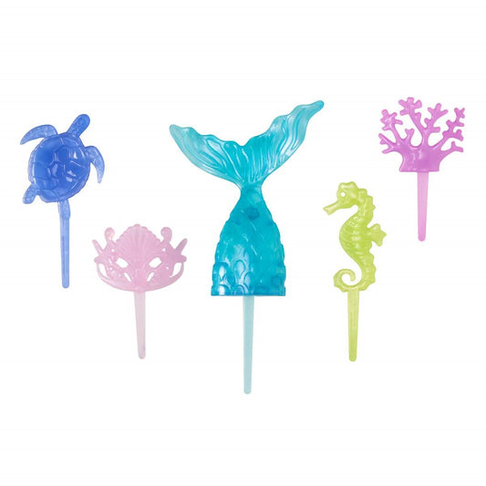 Set of five translucent ocean-themed plastic cake toppers including a blue mermaid tail, purple sea turtle, pink shell crown, green seahorse, and pink coral decoration.