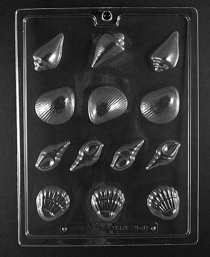 N061 SEASHELL ASSORTMENT chocolate mold featuring multiple small shell cavities in varied sizes with ribbed and spiral textures.