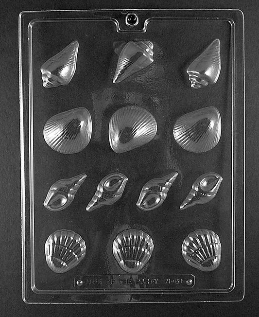 N061 SEASHELL ASSORTMENT chocolate mold featuring multiple small shell cavities in varied sizes with ribbed and spiral textures.