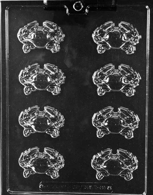 N062 CRAB PIECES chocolate mold with several small crab-shaped cavities showing claws and legs.