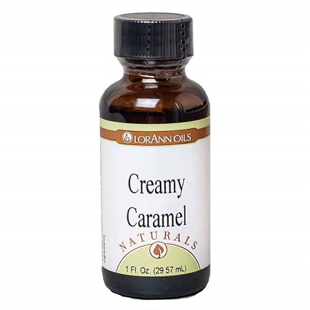1 oz amber bottle of LorAnn Natural Creamy Caramel Flavor with a black cap and a clean white label reading “Creamy Caramel” from the Naturals line. Ideal for baking and candy making.