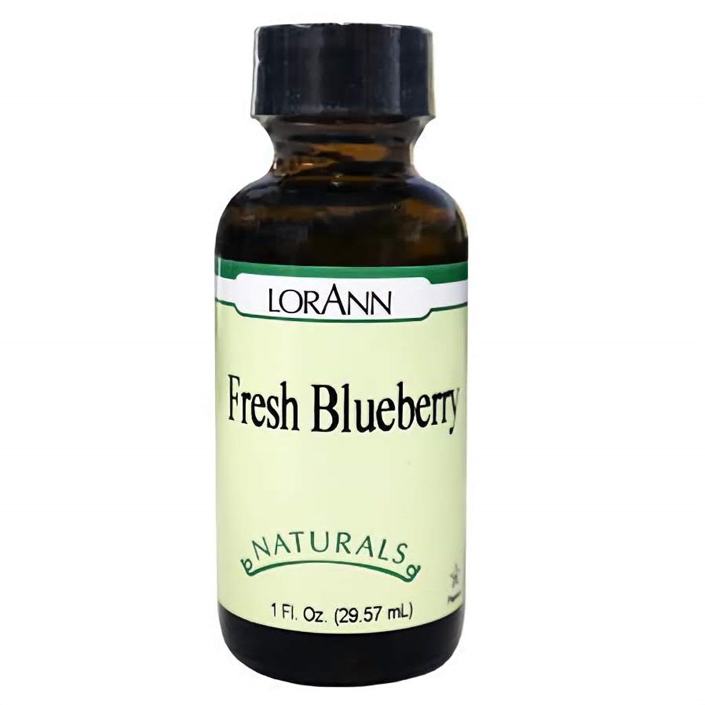 Amber glass bottle of LorAnn Natural Fresh Blueberry Flavor with black cap and pale green label marked “Fresh Blueberry” and “Naturals.” 1 oz bottle for baking and candy making.