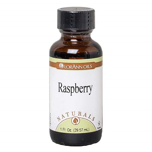 1 oz amber glass bottle of LorAnn Oils Natural Raspberry Flavor with black screw-on cap and white label. Label reads "Raspberry" and indicates it's part of the Naturals line.
