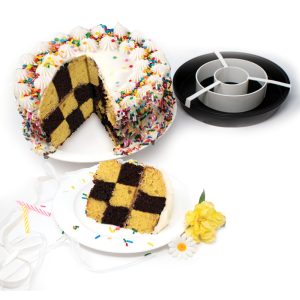 A decorated checkerboard cake with alternating chocolate and vanilla squares, alongside the cake pan set.