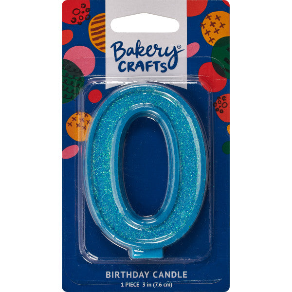 Glittery blue number zero 3" birthday candle in packaging from Bakery Crafts.