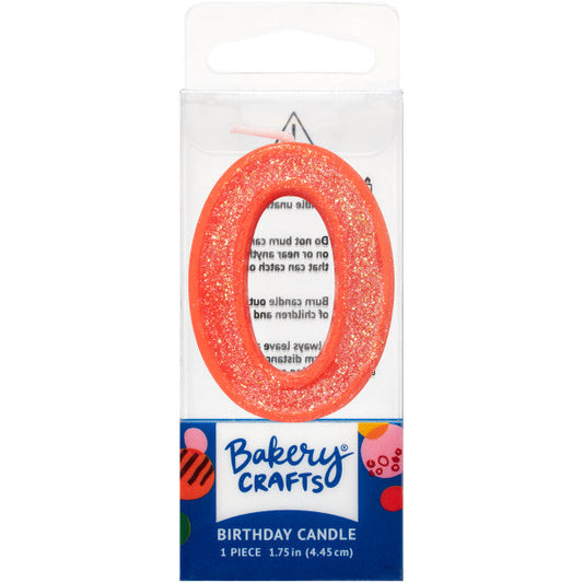 Glittery orange number zero 1.75" birthday candle in packaging from Bakery Crafts.