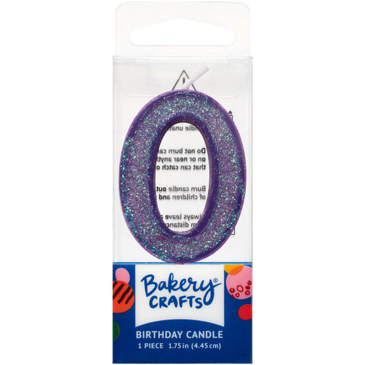 Glittery purple number zero 1.75" birthday candle in packaging from Bakery Crafts.