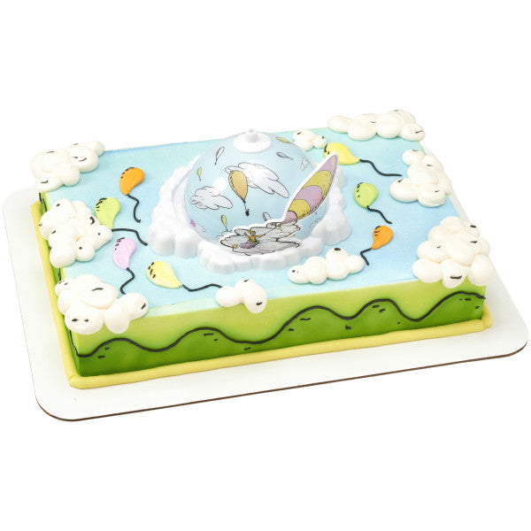 A rectangular cake decorated with clouds and balloons, featuring the spinning dome topper at the center.