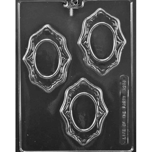 Clear three-cavity mold with ornate oval frame designs, scalloped edges, and raised detailing; glossy plastic set against a dark background.