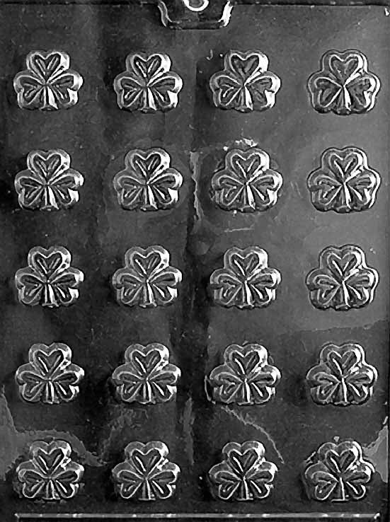 P001 BITE SIZE SHAMROCKS chocolate mold with many small shamrock-shaped cavities arranged across the sheet.