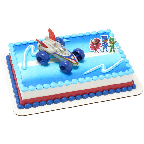 A rectangular cake decorated with the PJ Masks Saves the Day DecoSet®, featuring the Cat-Car and character topper on a blue-themed design.