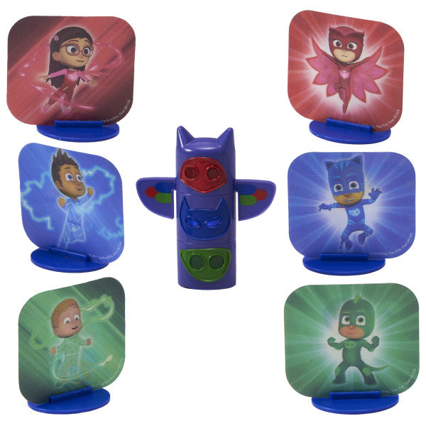 PJ Masks We're on Our Way DecoSet®, featuring a transformation totem pole and three character stands with magic motion decals of Catboy, Owlette, Gekko, and their human forms.