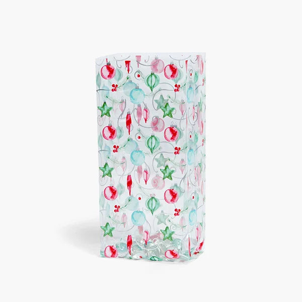 Clear Painted Ornaments Cello Treat Bag with watercolor-style Christmas ornaments in red, pink, aqua, and green, decorated with green stars and delicate holiday greenery.