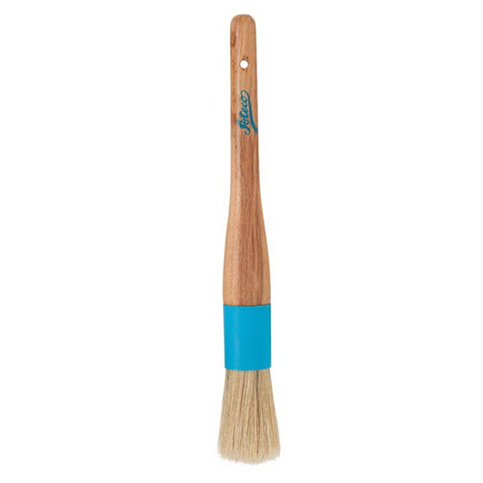 Round pastry brush with natural boar bristles, a composite ferrule, and a wooden handle with a hanging hole. Ideal for precise glazing and basting.