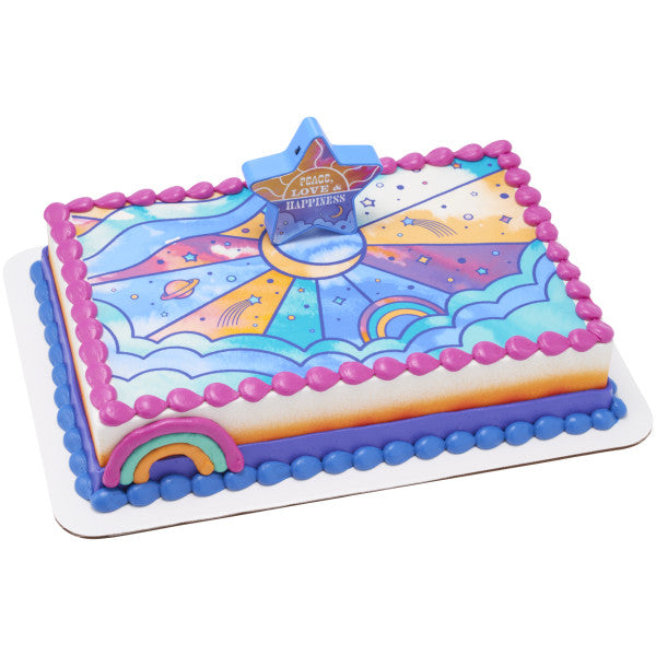 A vibrant cosmic-themed cake with a colorful galaxy-inspired design and the glowing star topper.