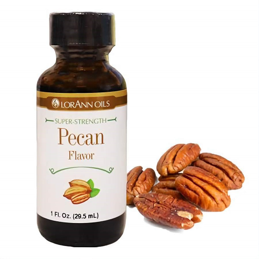 A bottle of LorAnn Oils Super-Strength Pecan Flavor, paired with whole pecans, indicative of the nutty and warm flavor profile of this baking essence.