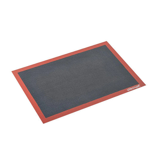 Rectangular perforated silicone baking mat with a dark gray center and red border, shown on a white background with Silikomart branding in the corner.