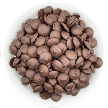 Peter's Eastchester Dark Chocolate Confectionery Melting Wafers in a white bowl, capturing the elegant, dark chocolate sheen ideal for rich dessert creations and chocolate fountains.