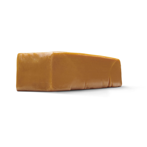 Large rectangular block of golden brown caramel with a smooth, slightly glossy surface and firm texture, shown against a white background.