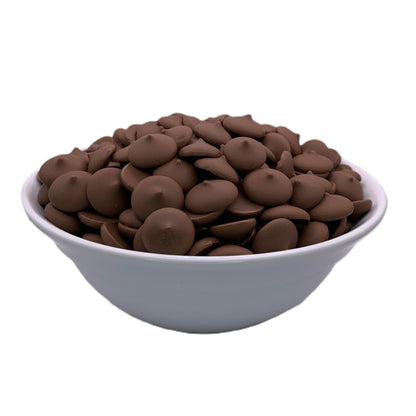 Bowl of Peters Eastchester dark chocolate melting wafers on a white background, angled to show the rich brown hue and smooth texture, perfect for elegant dessert creations.