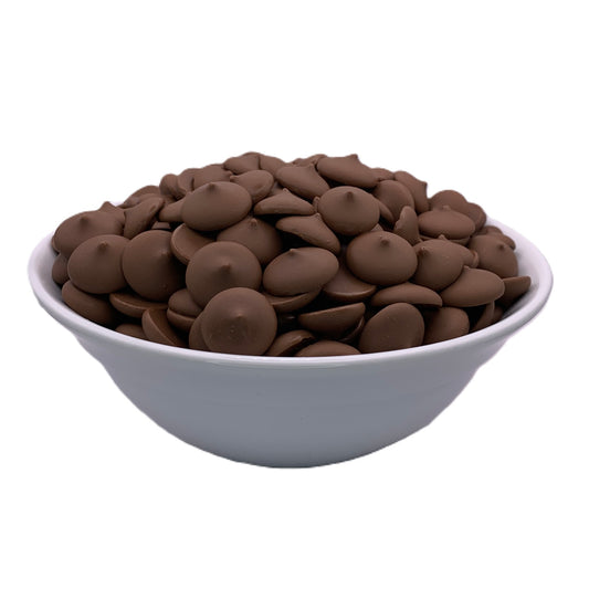 A close-up front view of Peter's Westchester milk chocolate melting wafers in a bowl, featuring a rich, velvety texture ideal for professional-grade chocolate confections.