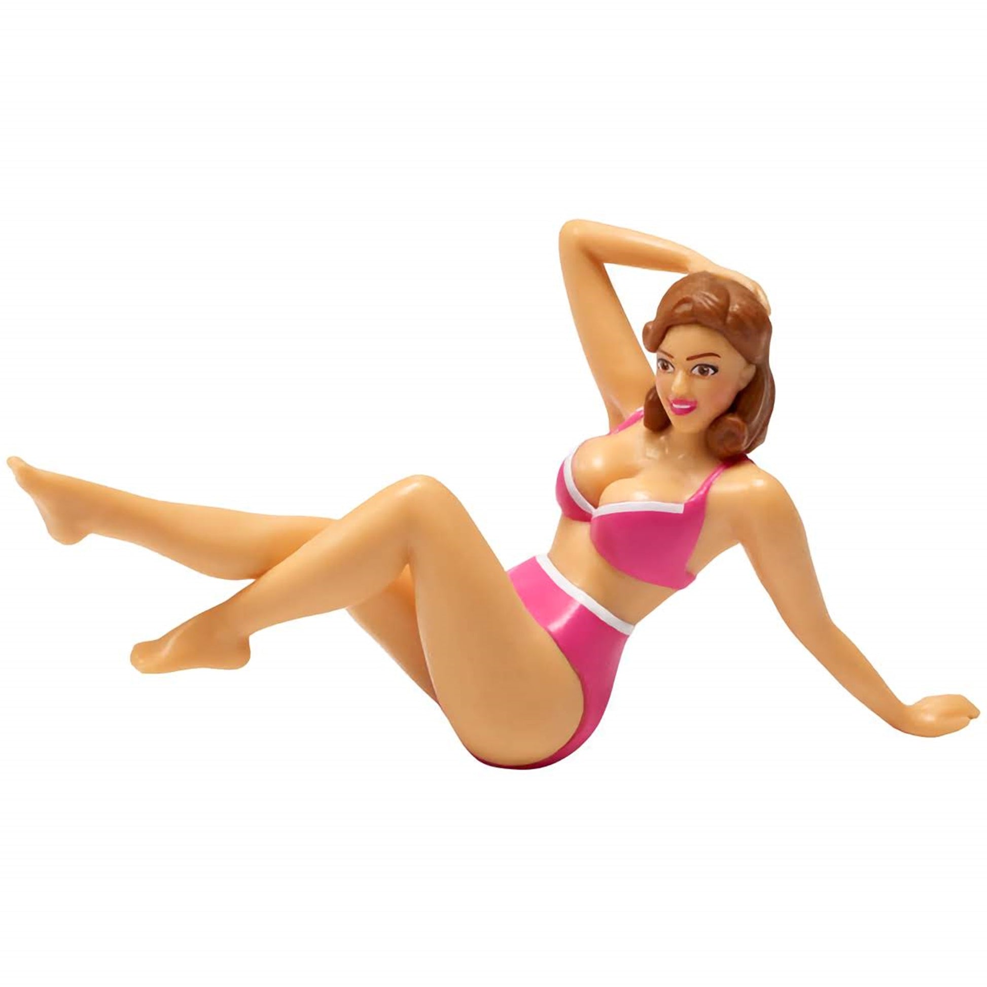 A plastic cake topper depicting a woman in a pink bikini, posed lying down with one hand behind her head. This topper adds a playful and cheeky touch to adult-themed party cakes and can be found at Lynn's Cake, Candy, and Chocolate Supplies.