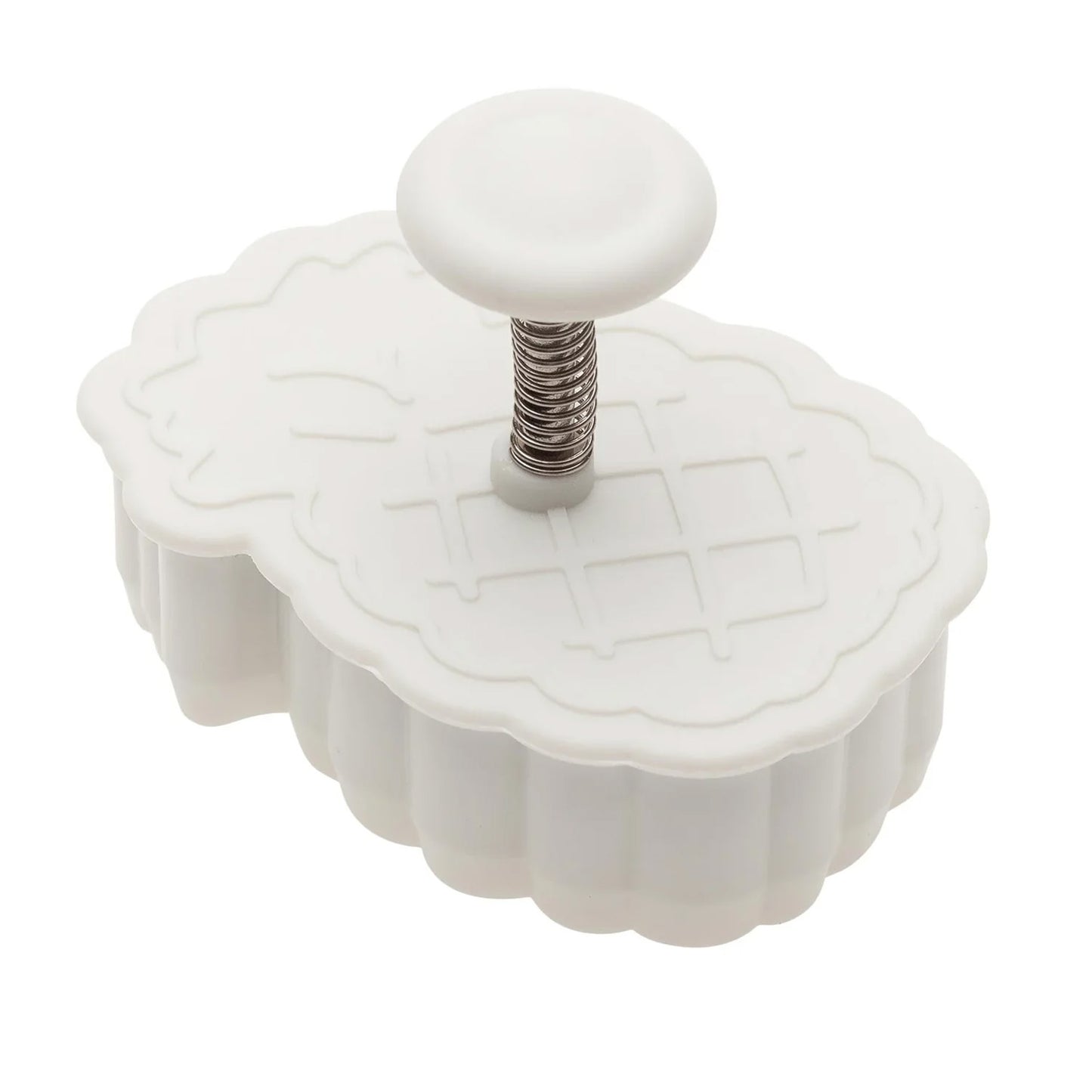 White pineapple plunger cutter with a round button and visible spring mechanism on top, shown on a white background.