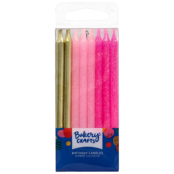 Clear retail package of Bakery Crafts birthday candles showing assorted metallic gold, light pink, and dark pink glitter candles arranged vertically with a blue label.