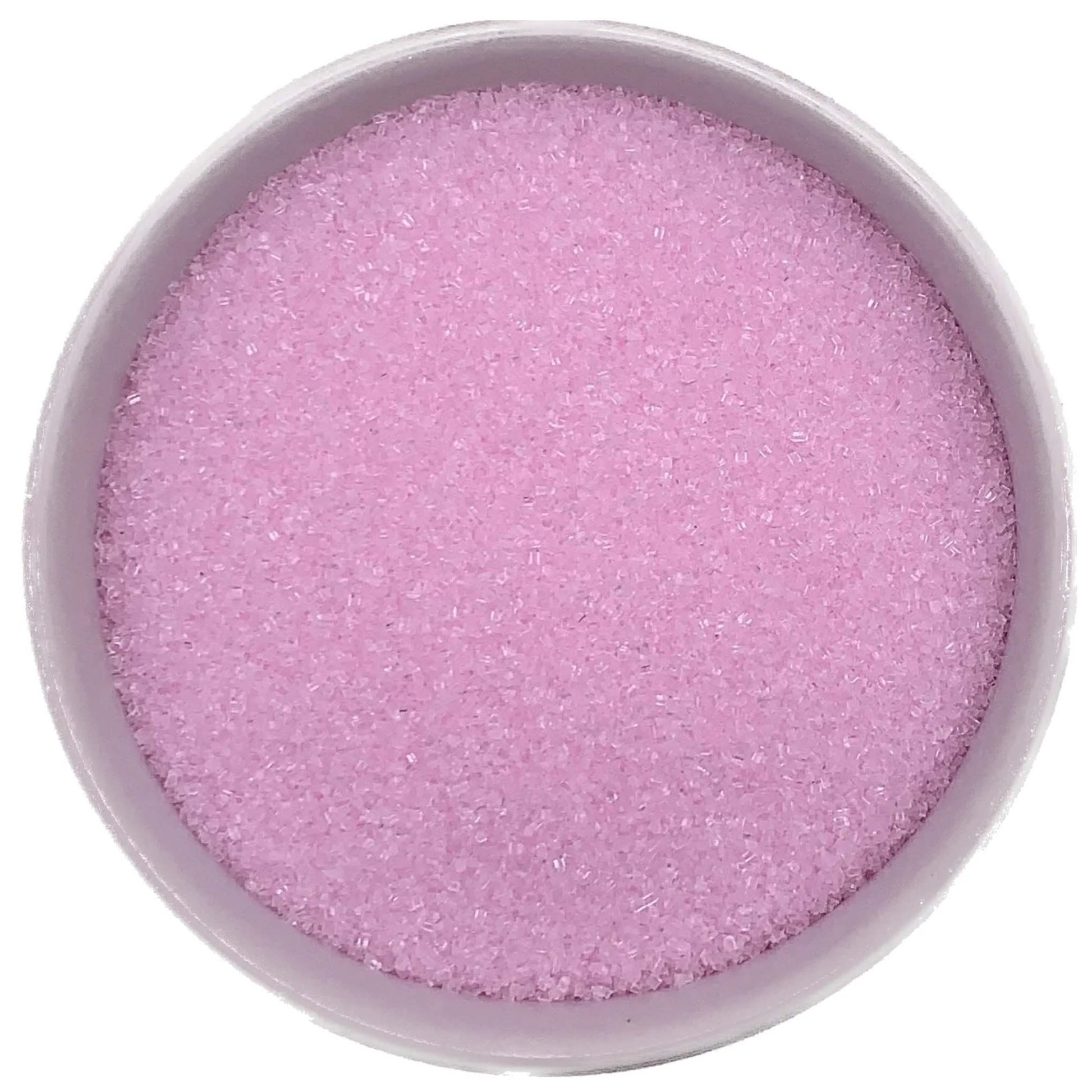 Bowl of pastel pink fine sanding sugar crystals on a white background.