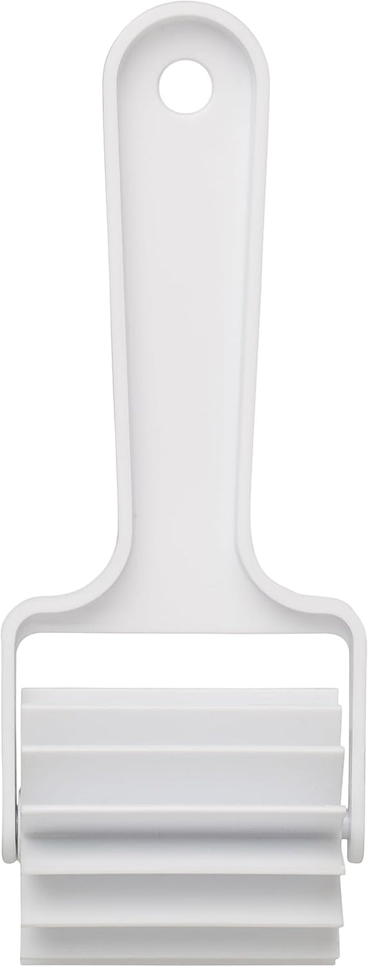 Ateco 1358 Bear Claw Cutter with a white plastic handle and rolling blade for scoring pastry dough.