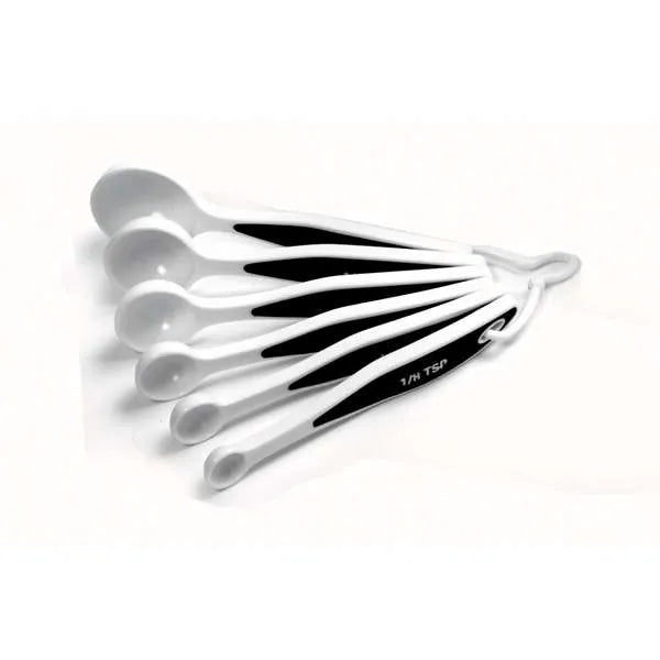 Side view of six-piece Grip-EZ measuring spoon set stacked together on a white background