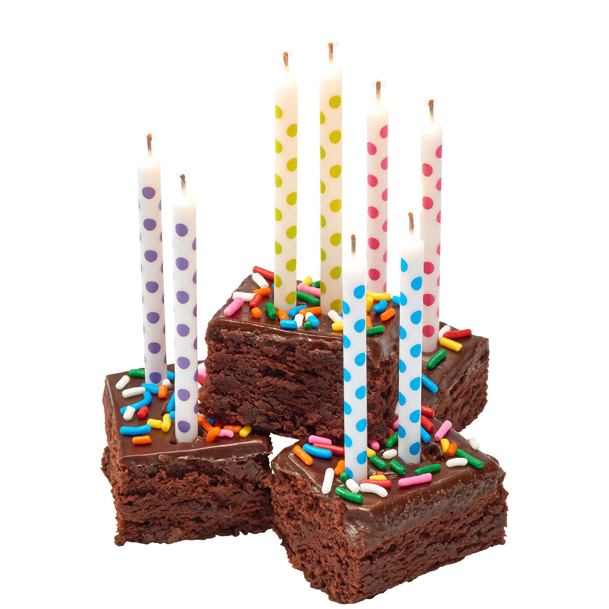 Polka dotted white birthday candles on brownies. 