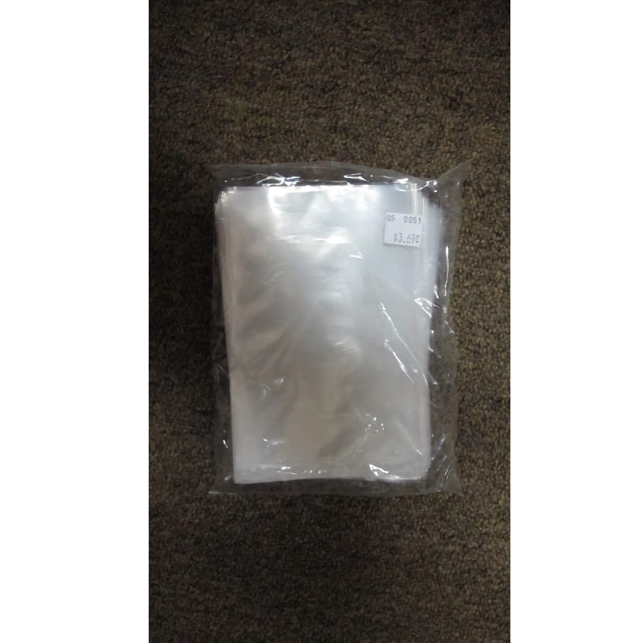 A pack of 100 clear poly bags suitable for suckers, with a size label of 4 x 6 inches. The plastic is slightly reflective and semi-translucent, allowing some light to pass through and give a glimpse of the bags inside.