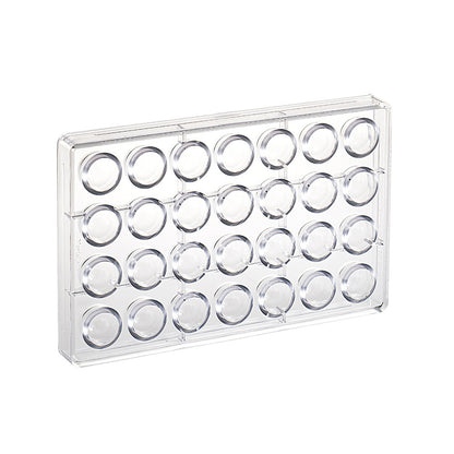 Clear polycarbonate chocolate mold with 28 round cavities arranged in rows, shown on a white background.
