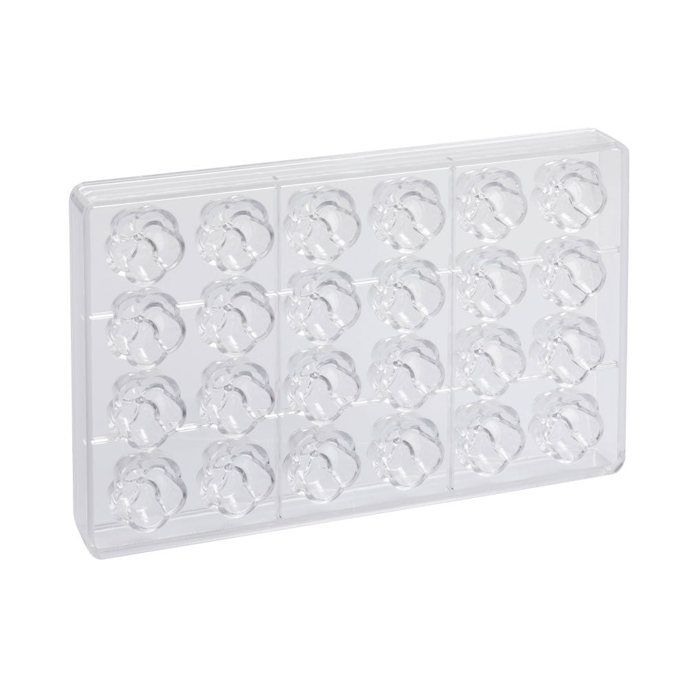 Clear polycarbonate chocolate mold tray with 24 flower-shaped cavities arranged in rows on a white background.