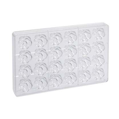 Clear polycarbonate chocolate mold tray with 24 flower-shaped cavities arranged in rows on a white background.