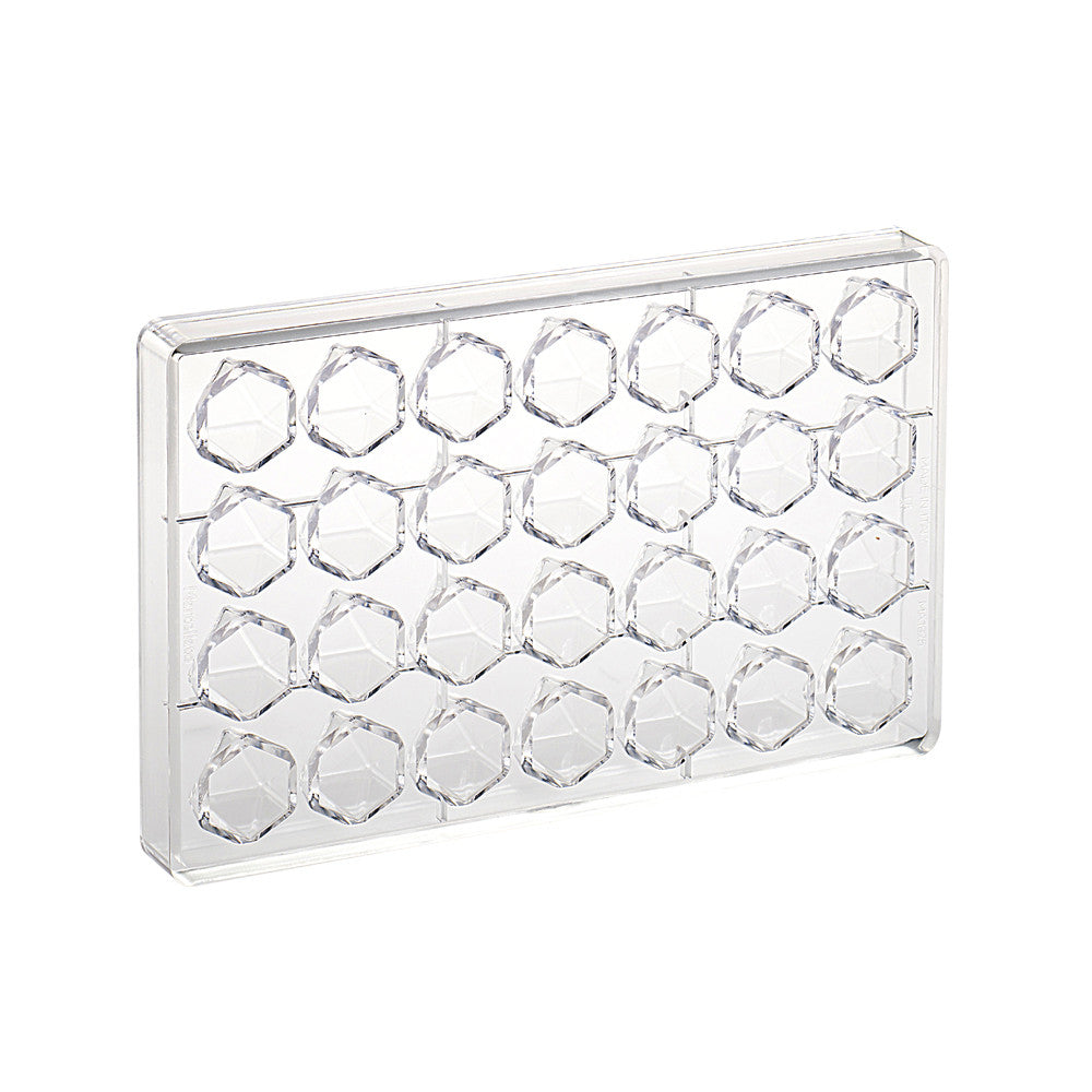 Clear polycarbonate chocolate mold with 28 geometric faceted cavities arranged in rows, shown on a white background.