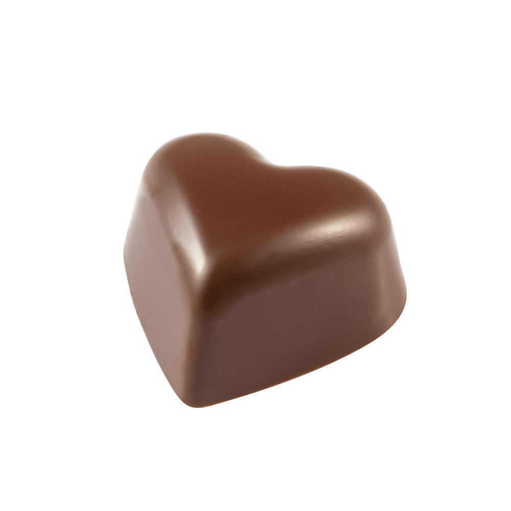 Finished heart-shaped chocolate bonbon with smooth glossy surface in milk chocolate color, shown on a white background.