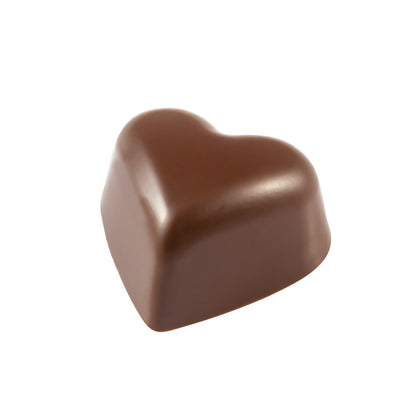 Finished heart-shaped chocolate bonbon with smooth glossy surface in milk chocolate color, shown on a white background.