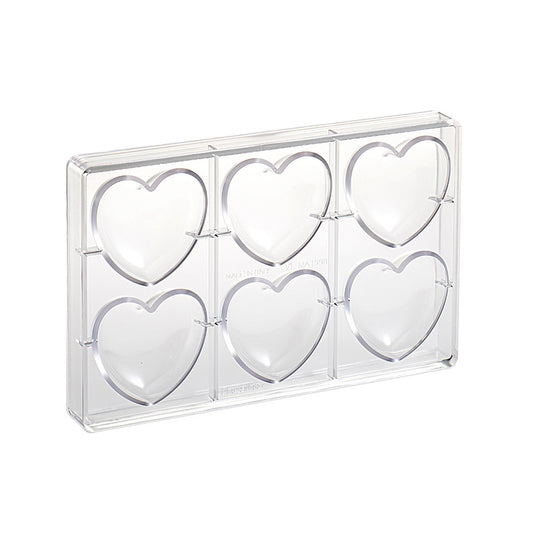 Clear polycarbonate chocolate mold with six large heart-shaped cavities arranged in two rows, shown on a white background.