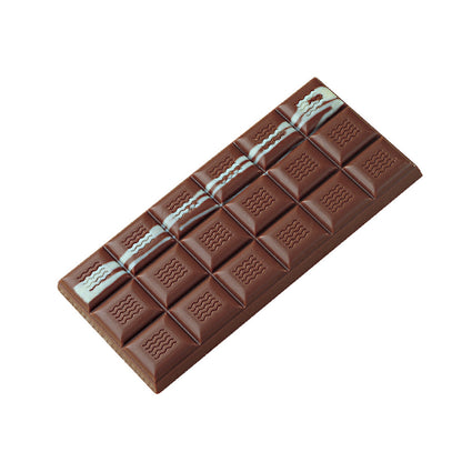 Finished segmented chocolate tablet bar with a row of pale blue cocoa butter decoration across several squares, shown on a white background.