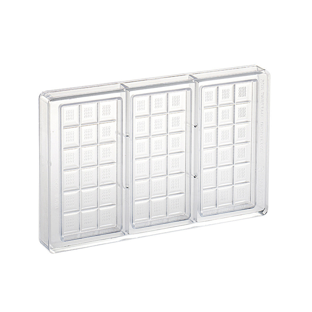 Clear polycarbonate chocolate tablet mold with three long bar cavities, each divided into small squares with a subtle wavy texture, shown on a white background.