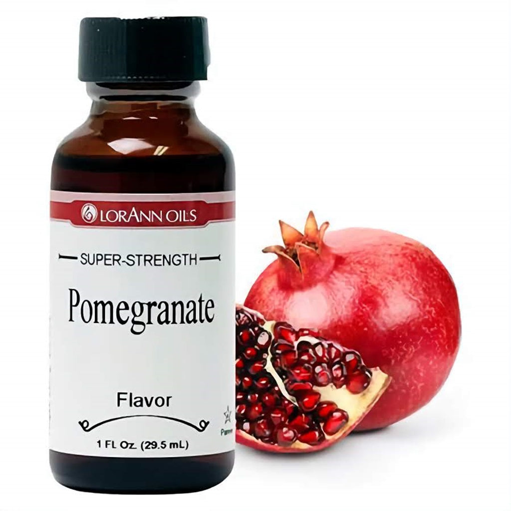 Compact bottle of LorAnn Oils Super-Strength Pomegranate Flavor with a ripe pomegranate and its arils in the background, indicative of the bold, sweet-tart flavor profile.