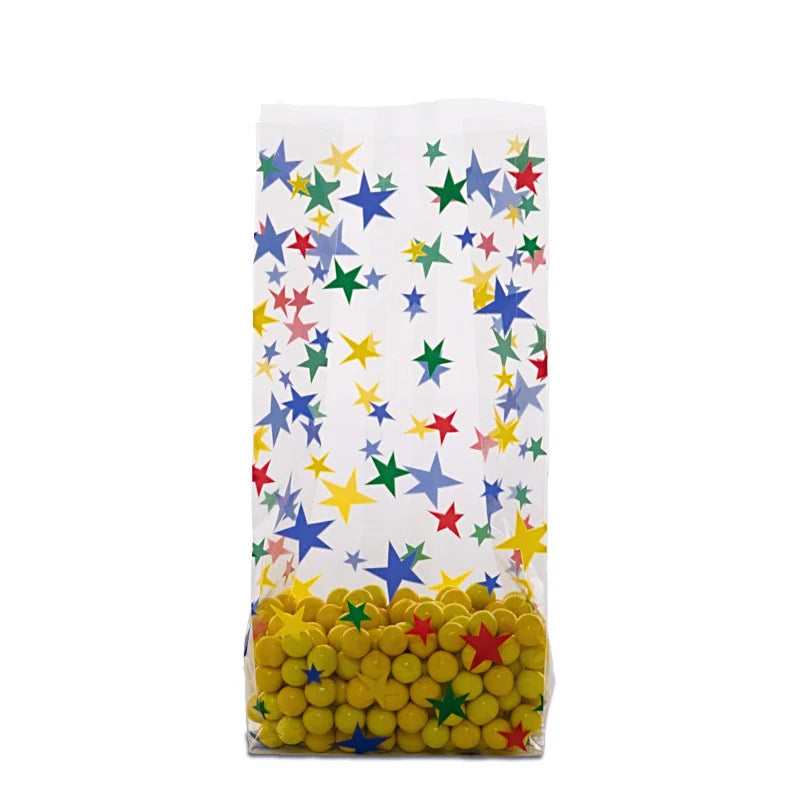 Clear gusseted cello bag with colorful star pattern, filled with yellow candy balls, ideal for party favors, kids’ events, or retail packaging.