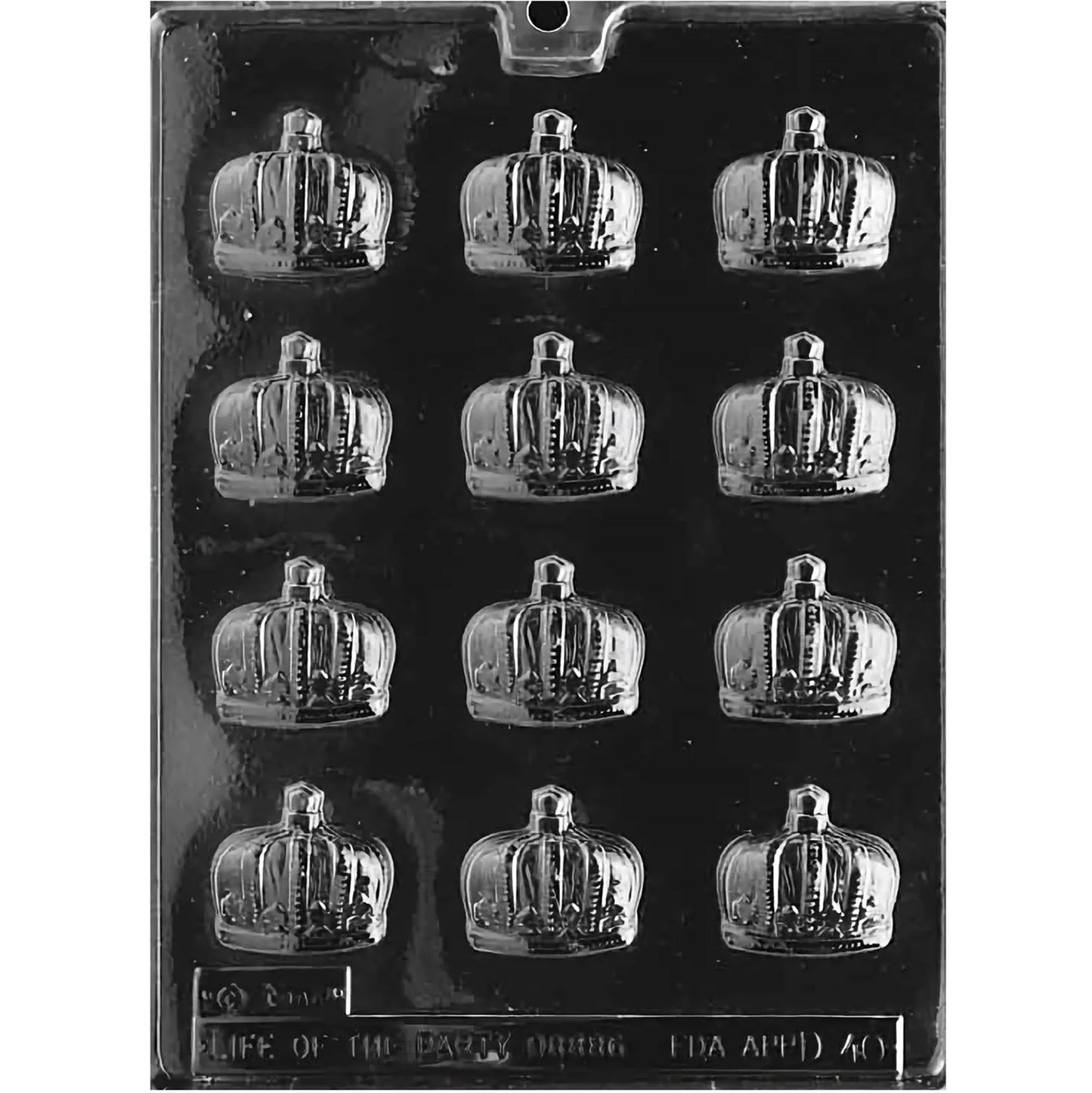 Clear plastic prince crown chocolate mold with twelve mini crown cavities, photographed on a dark background.