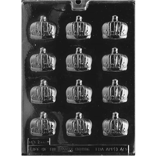 Clear plastic prince crown chocolate mold with twelve mini crown cavities, photographed on a dark background.